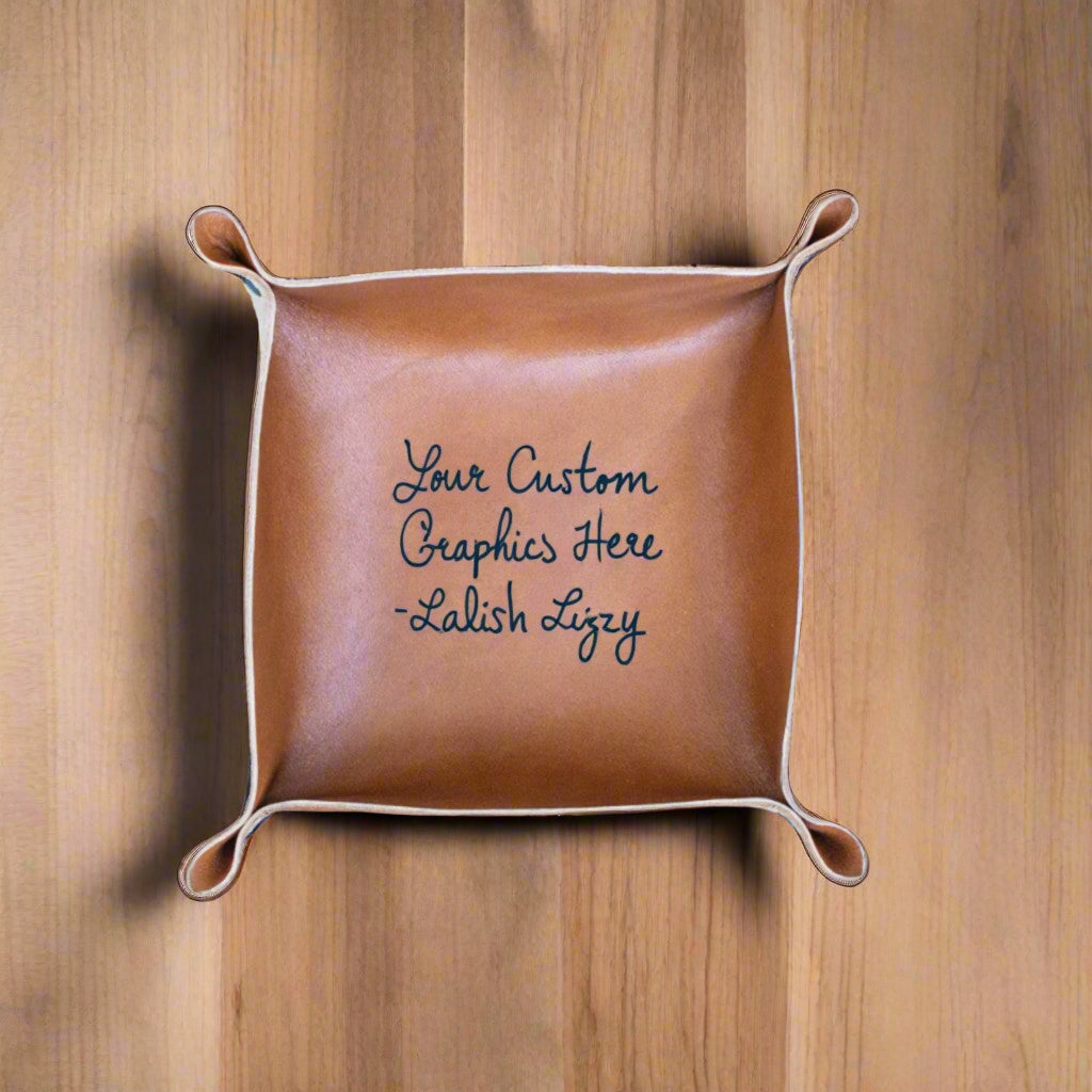 Brown leather tray with personalized text on a wooden surface